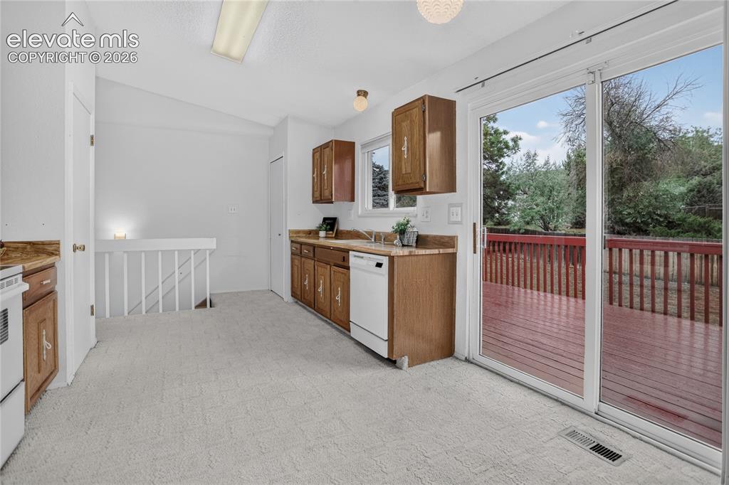 Image 7 of 21: Kitchen w/ walk-out