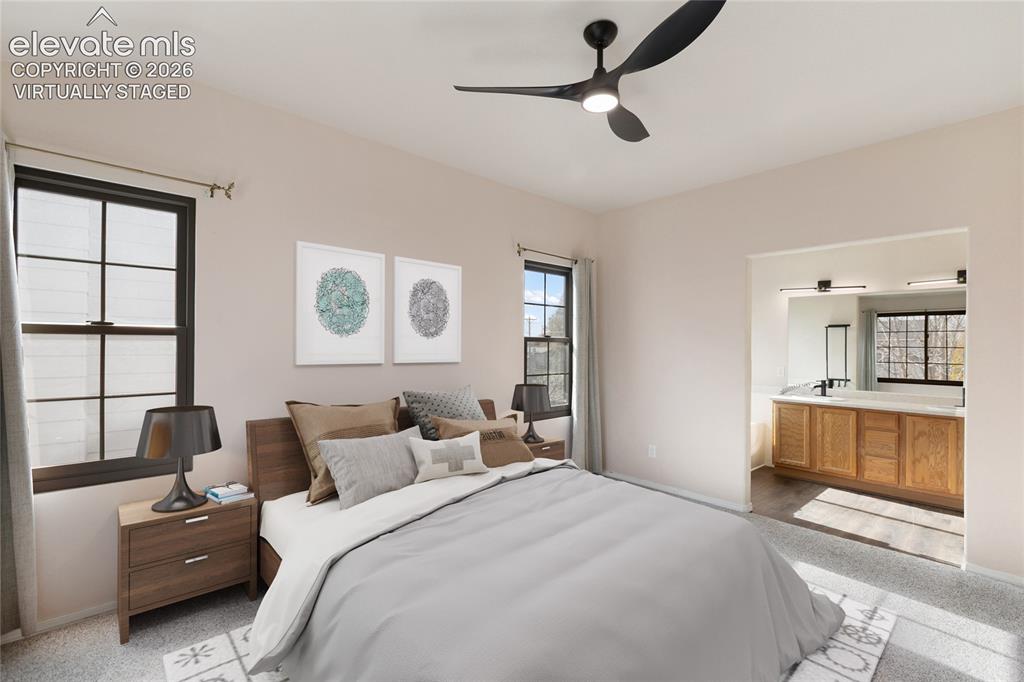 Image 18 of 38: *Virtually Staged* Bedroom featuring a ceiling fan with integrated lighting