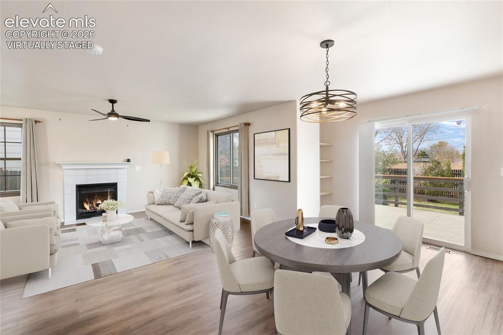 Image 9 of 38: *Virtually Staged* Open-concept living space featuring wood-finish flooring
