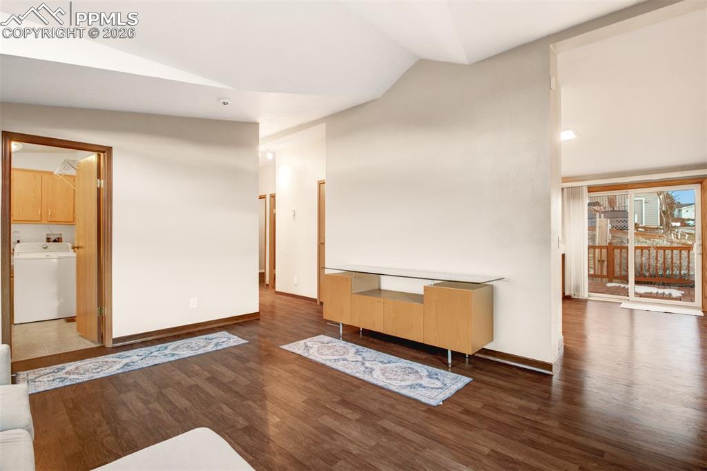 Image 5 of 26: Off the entry/living room in the laundry room and hall to the bedrooms