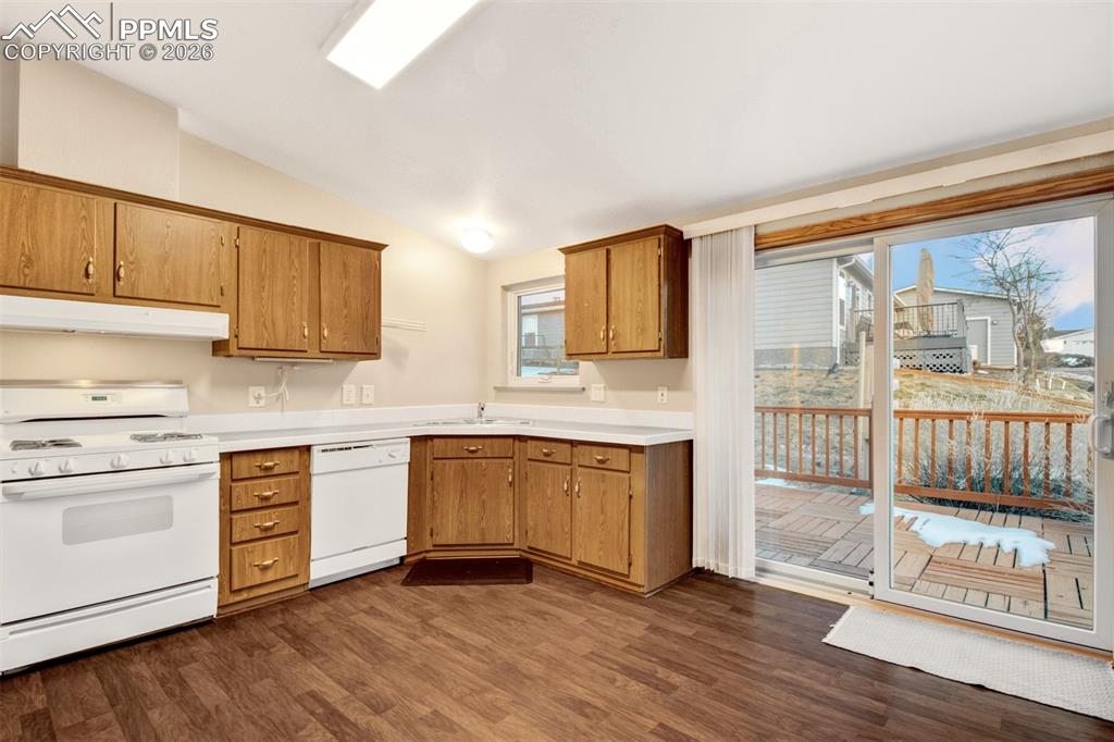 Image 7 of 26: Open kitchen with vauled ceilings and walkout access