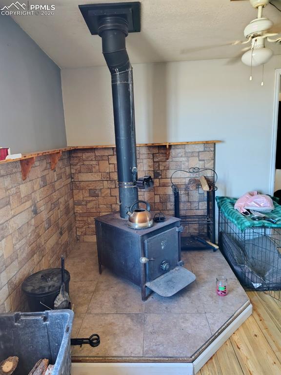 Image 30 of 30: Home 3 Wood stove