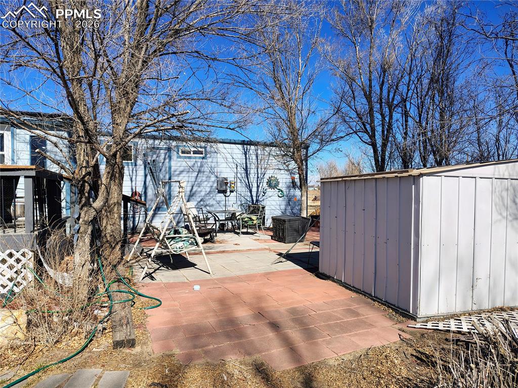 Image 5 of 11: garden shed and patio