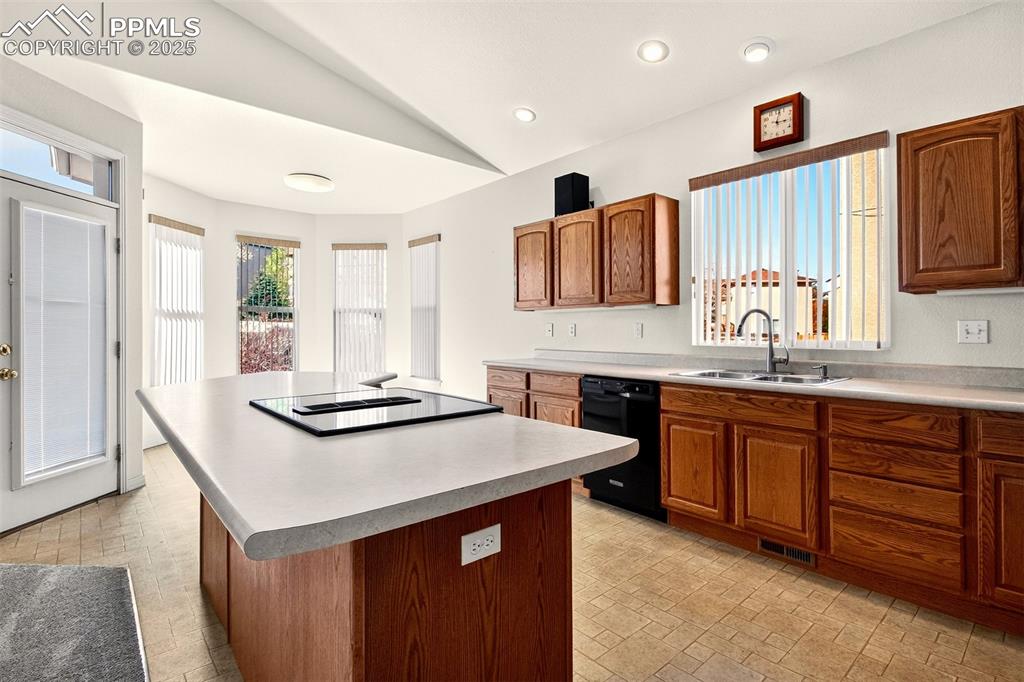 Image 11 of 41: Kitchen with a practical island, perfect for meal prep and entertaining