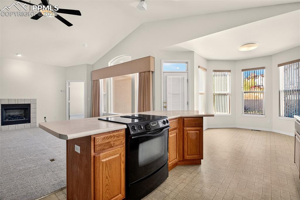Image 12 of 41: Kitchen with walkout access to the patio