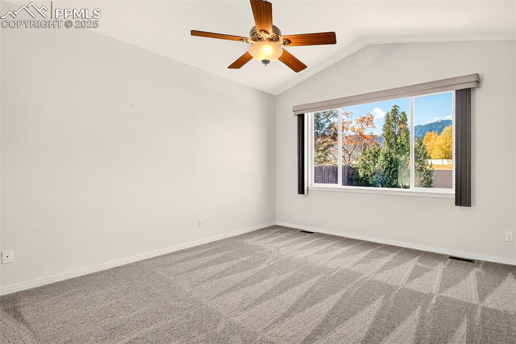 Image 14 of 41: Primary bedroom with breathtaking mountain views