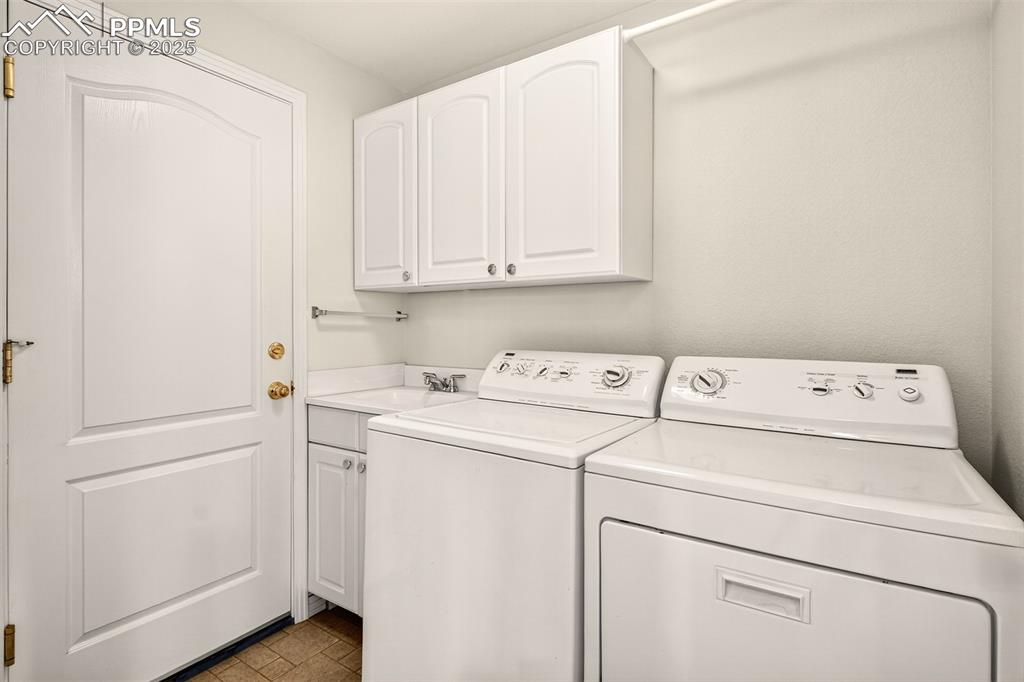 Image 22 of 41: Mudroom with sink, conveniently located off the garage