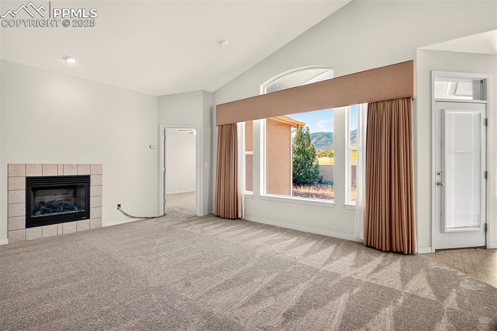 Image 7 of 41: Bright living room featuring beautiful mountain views