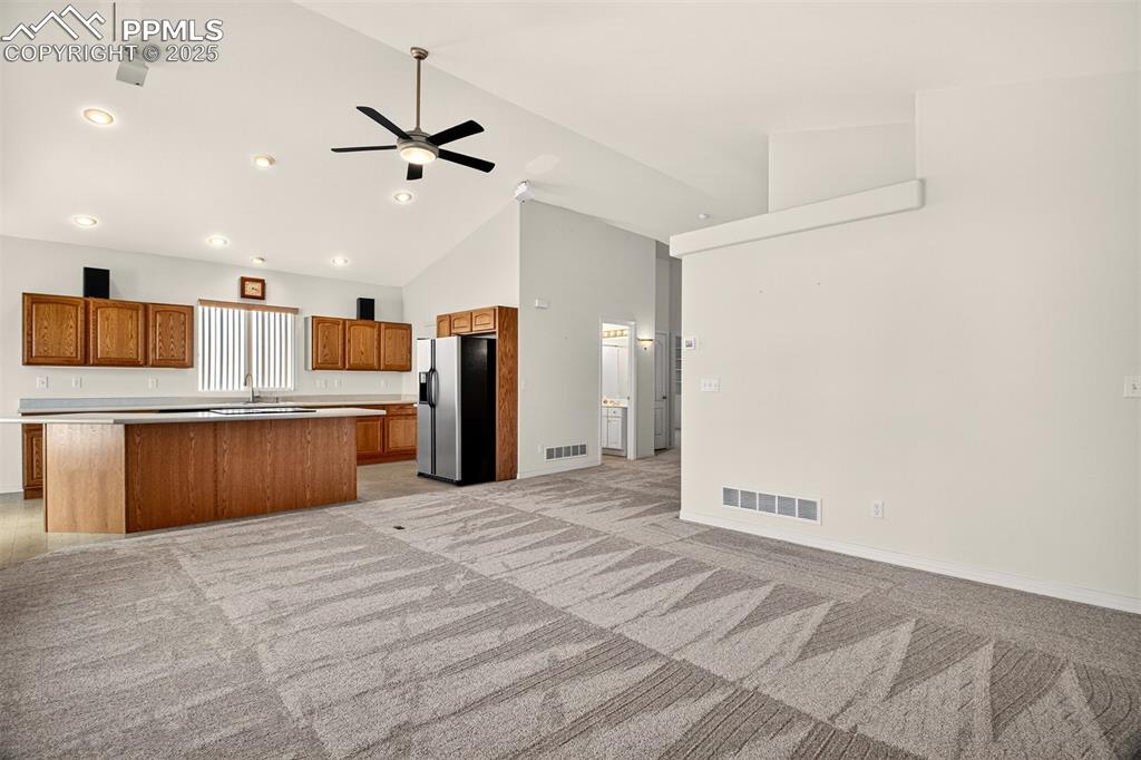 Image 9 of 41: Open-concept layout seamlessly connecting the kitchen and living room