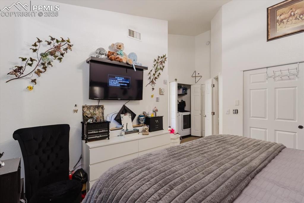 Image 28 of 35: Interior room featuring white walls and high ceilings