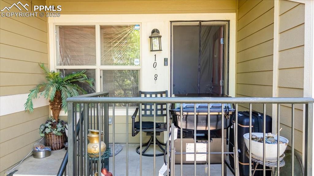 Image 4 of 35: Inviting front porch featuring horizontal siding, a framed window, exterior
