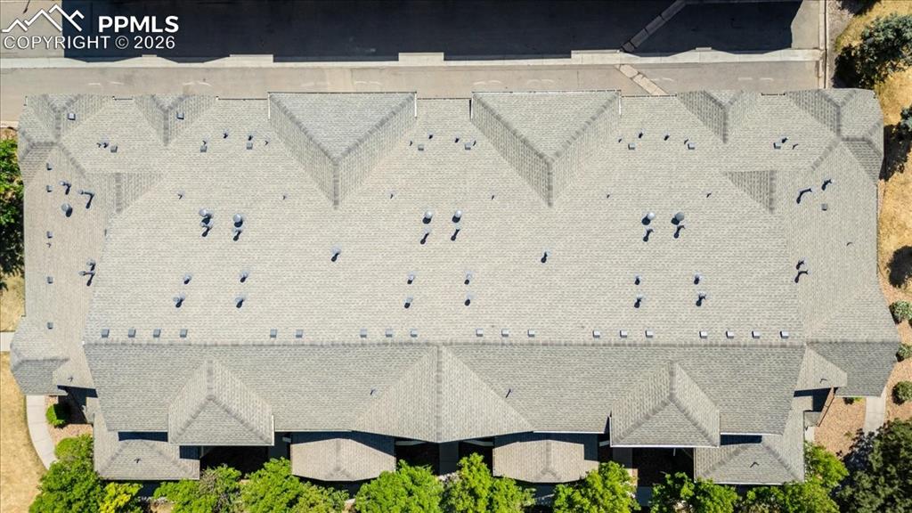 Image 7 of 35: Shingled roofline featuring multiple gables and numerous ventilation units