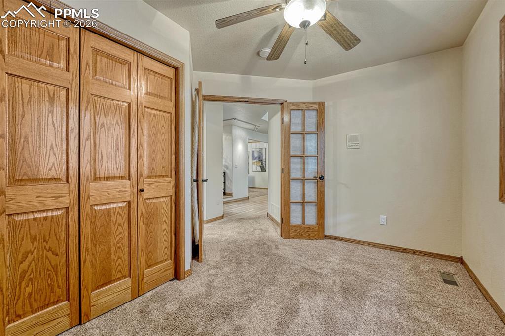 Image 10 of 50: Wood closet in the main level Bedroom/Office.