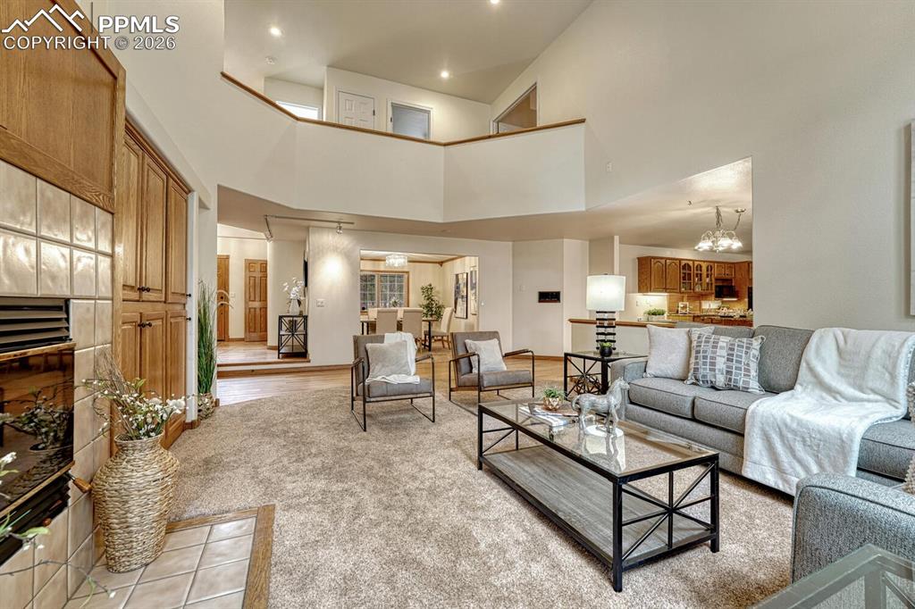 Image 15 of 50: View of the Entry, Dining Room, and Kitchen from the Family Room.