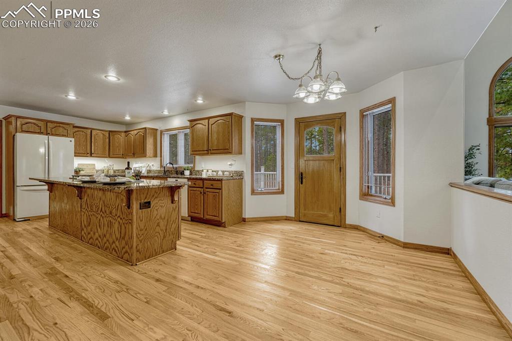 Image 16 of 50: The Gourmet Island Kitchen has a breakfast nook for informal dining and a w