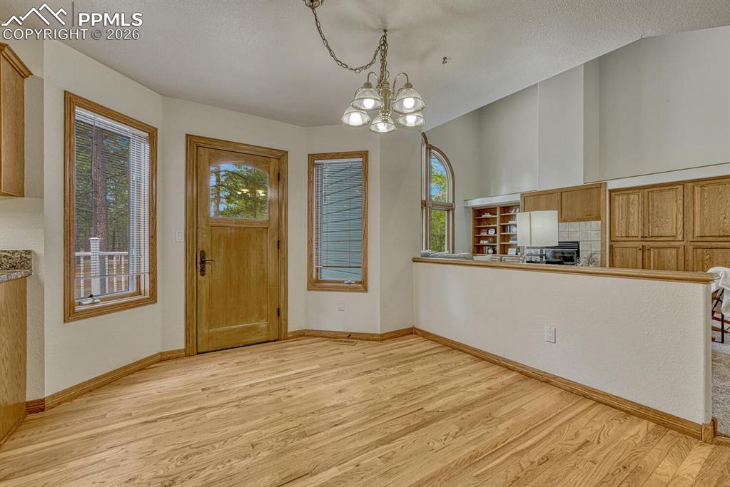 Image 17 of 50: Dining Nook with access to the backyard deck for outdoor dining and relaxat