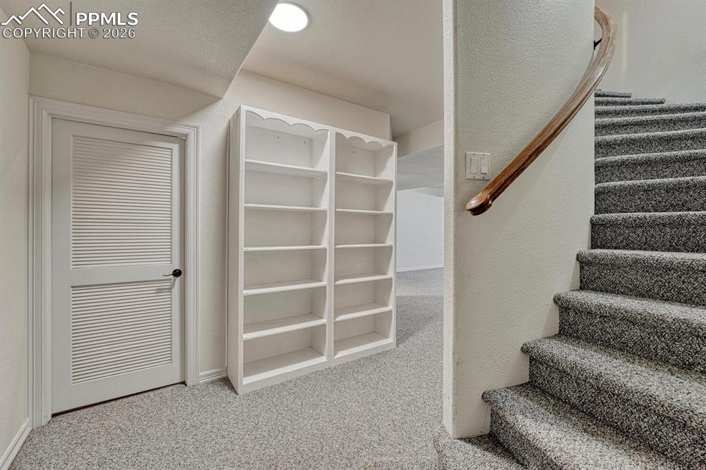 Image 36 of 50: Spiral staircase to the finished Basement.