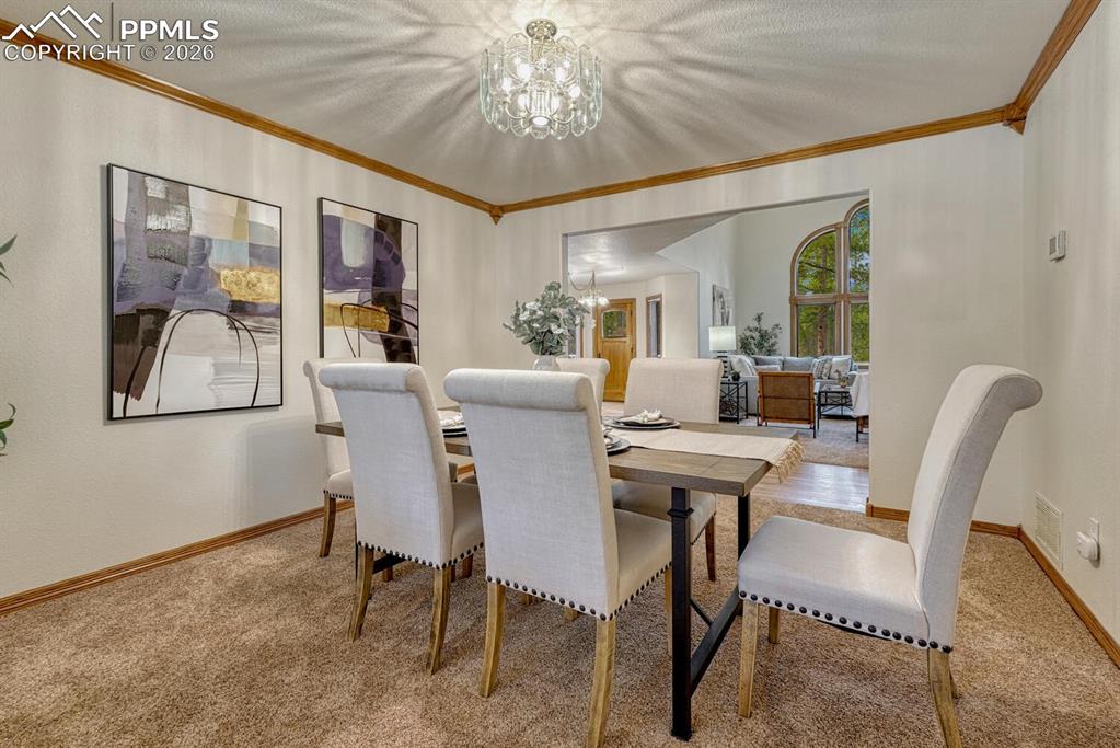 Image 8 of 50: Formal Dining Room.