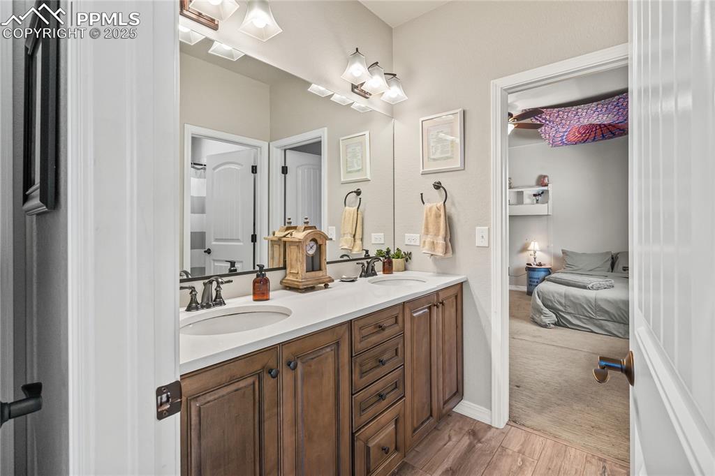 Image 28 of 50: Jack & Jill Bathroom, dual vanity, quartz, LVP floors, private tub/shower c