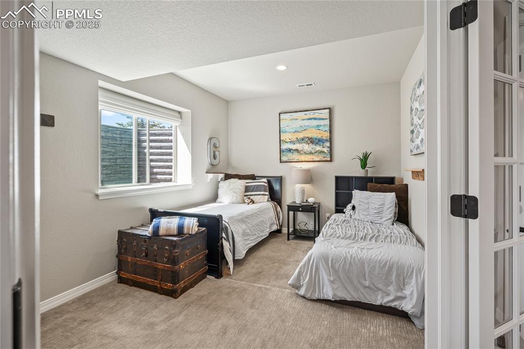 Image 41 of 50: Basement Office, great natural light, glass french doors