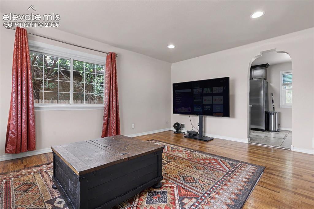 Image 3 of 36: Wood-finish flooring with baseboard trim, neutral wall paint, Virtually sta