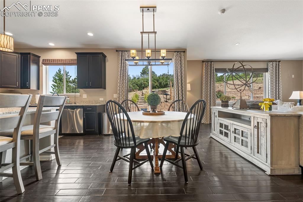 Image 10 of 46: Dining area with healthy amount of natural light, recessed lighting, and da
