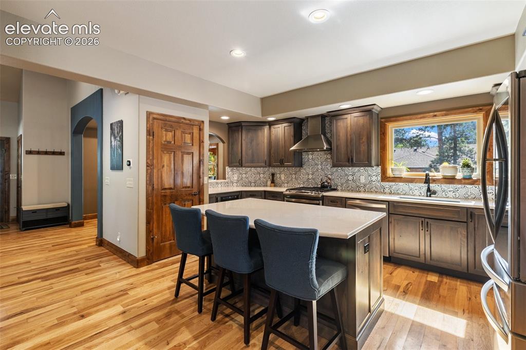 Image 16 of 49: Sliding glass to the backyard and patio.