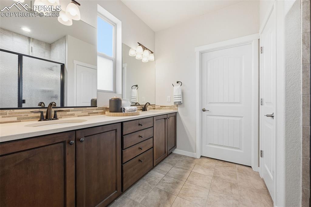 Image 18 of 39: Spacious spa like master bath with walk in closet and private water closet!