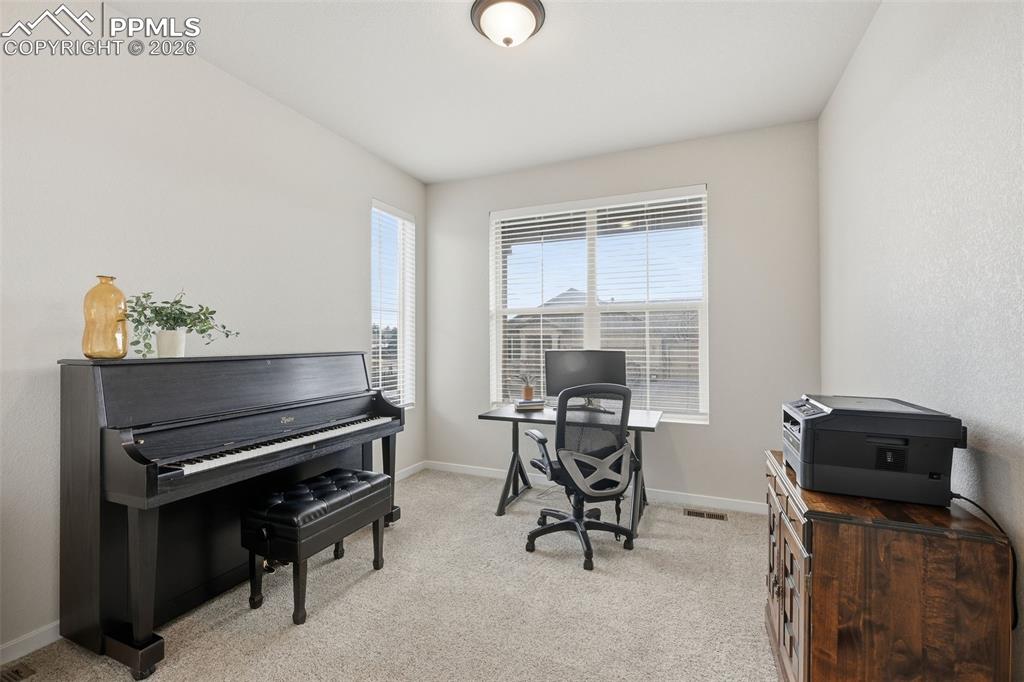 Image 19 of 39: Main level secondary bedroom being used as an office!