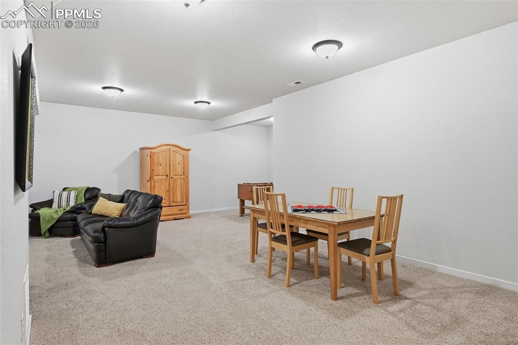 Image 25 of 39: Another view of the wonderful basement with room for entertaining!