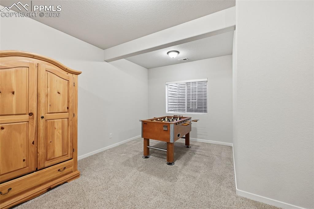 Image 27 of 39: Room for games in the basement!