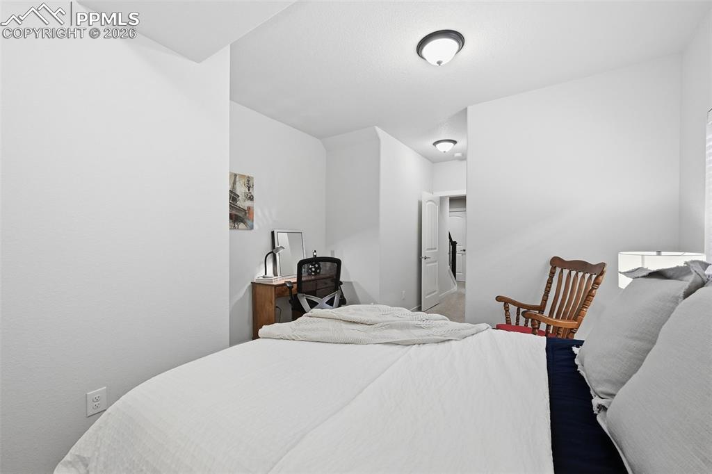 Image 32 of 39: Another view of the fourth bedroom with desk nook!