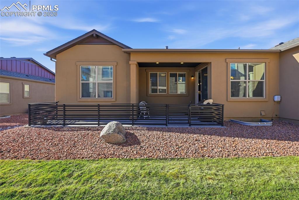 Image 34 of 39: Partially covered back deck with privacy!