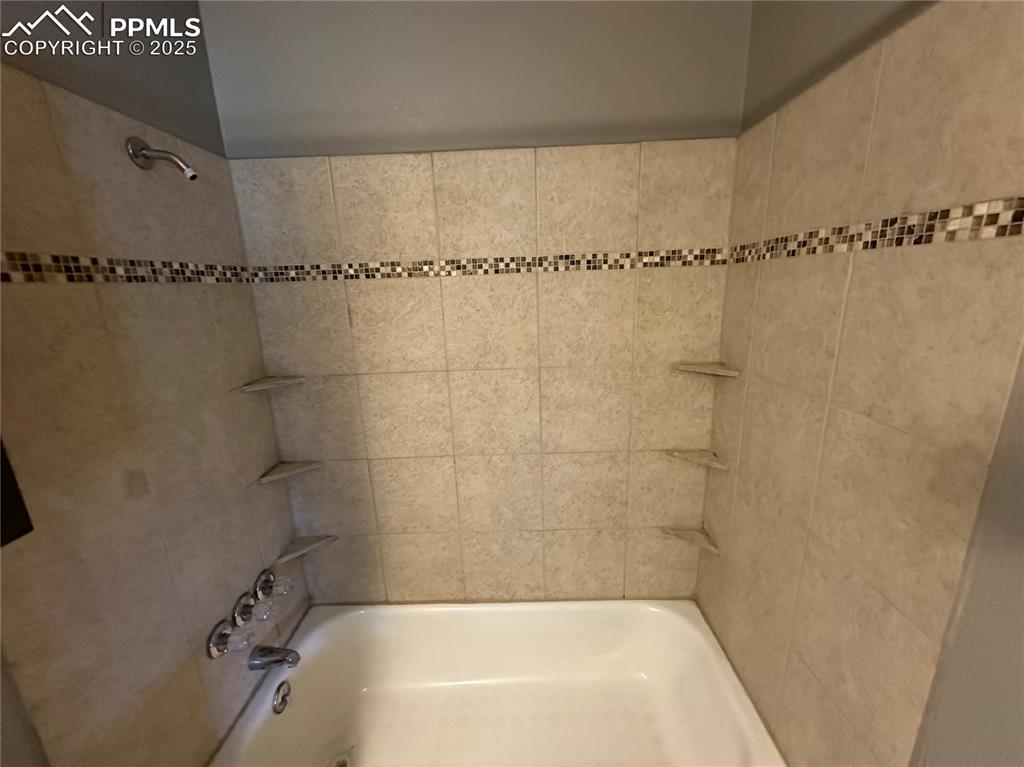 Image 10 of 13: Full bathroom with shower / bath combination