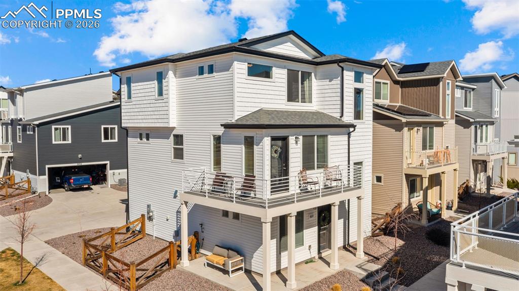 Image 1 of 37: View of front of home featuring a residential view, a patio area, a wooden