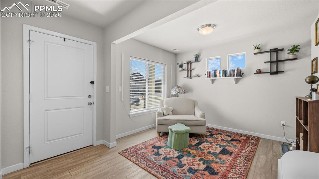 Image 2 of 37: Entrance foyer with baseboards and light wood-style flooring