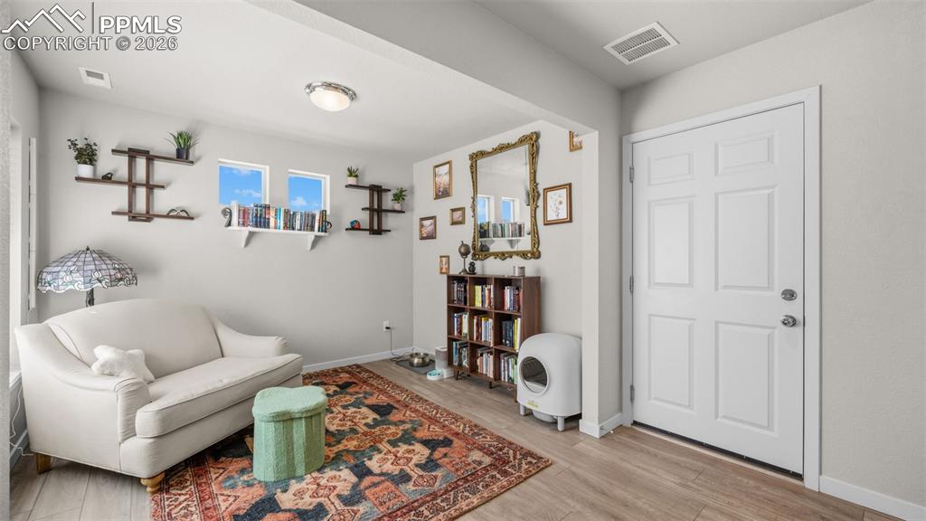 Image 3 of 37: Living area with light wood-style flooring and baseboards
