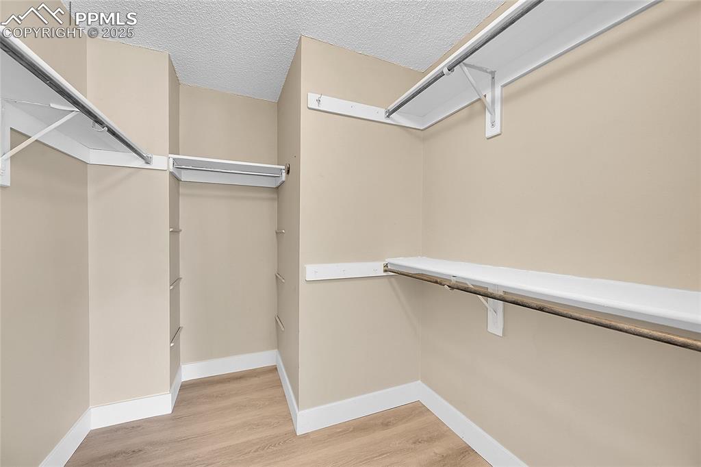 Image 26 of 39: Spacious closet featuring light wood-type flooring