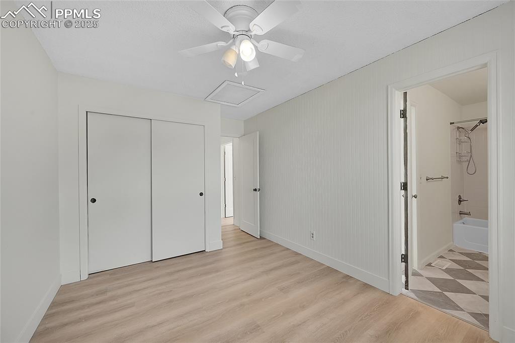 Image 30 of 39: Unfurnished bedroom with light wood-type flooring, a closet, ceiling fan, a