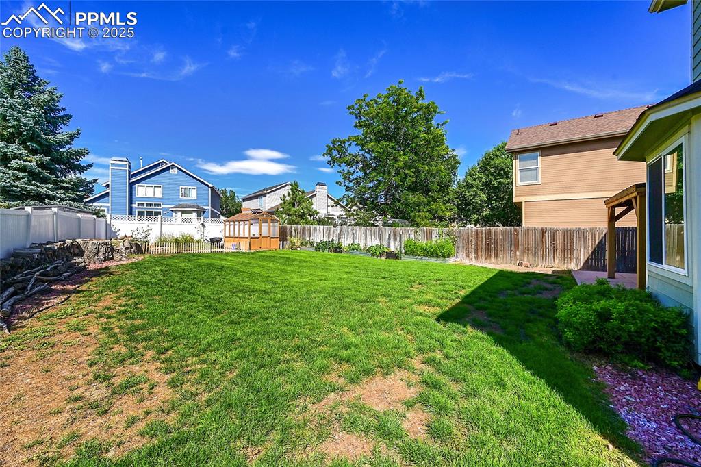 Image 39 of 39: View of fenced backyard