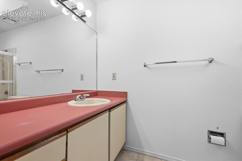 Image 15 of 26: Primary ensuite bathroom vanity at , Colorado Springs, CO.
