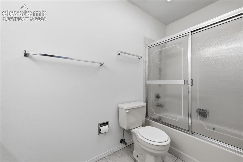 Image 16 of 26: Primary ensuite bath with a tub-shower combo at , Colorado Springs, CO.