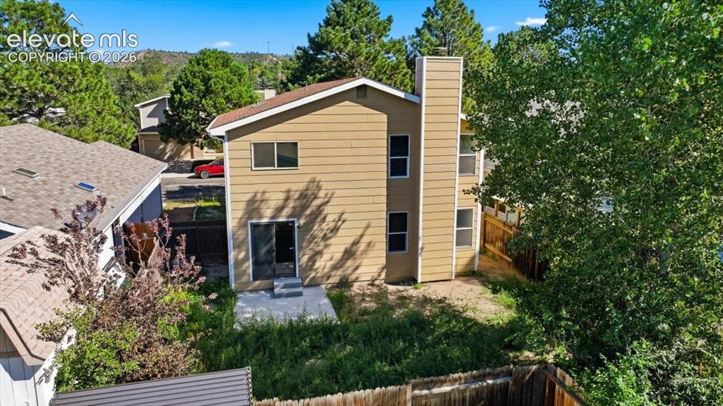 Image 23 of 26: Aerial rear exterior view with a mountain backdrop at , Colorado Springs, C