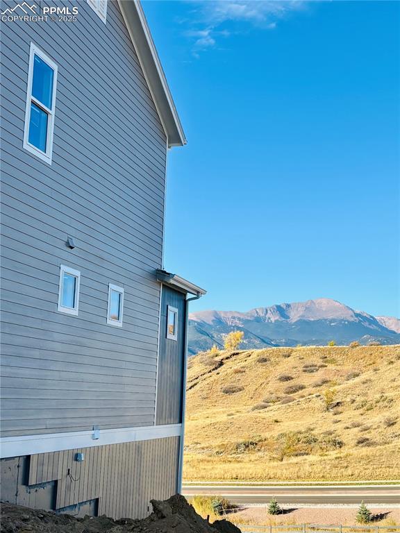 Image 4 of 21: View of property exterior featuring a mountain view