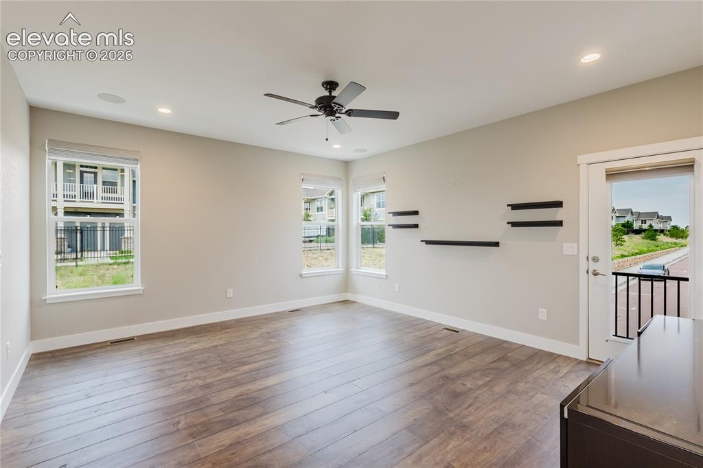 Image 14 of 45: Living room with deck walk-out. 