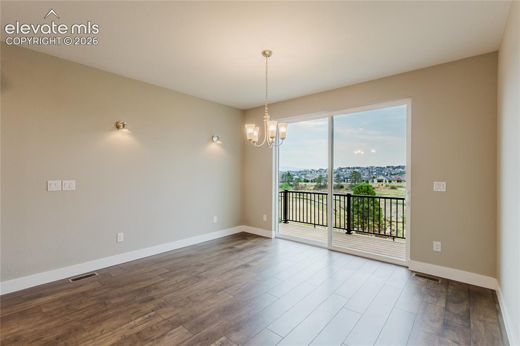 Image 15 of 45: Dining room w/walk-out. 
