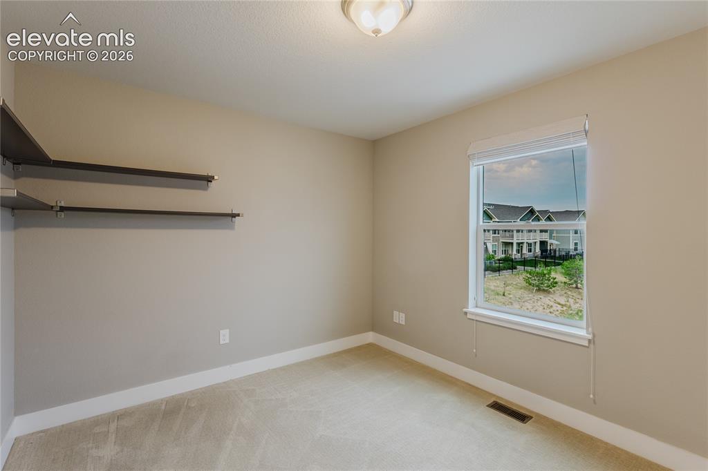 Image 26 of 45: Second bedroom on top floor. 