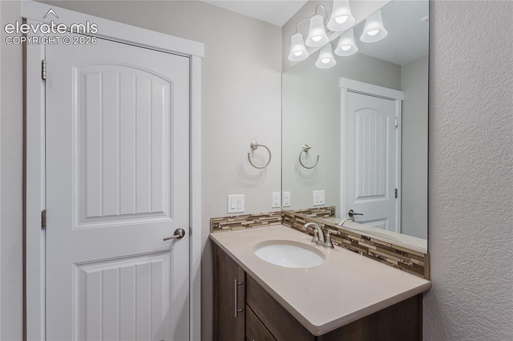 Image 29 of 45: Full bathroom in 2nd bedroom on top floor. 