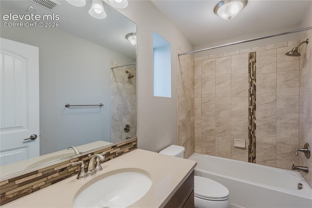 Image 30 of 45: Full bathroom in 2nd bedroom on top floor. 