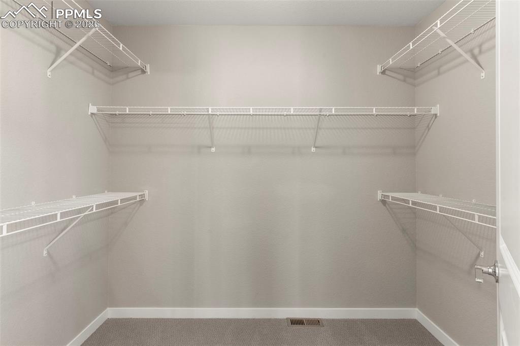 Image 21 of 33: Expansive walk-in closet